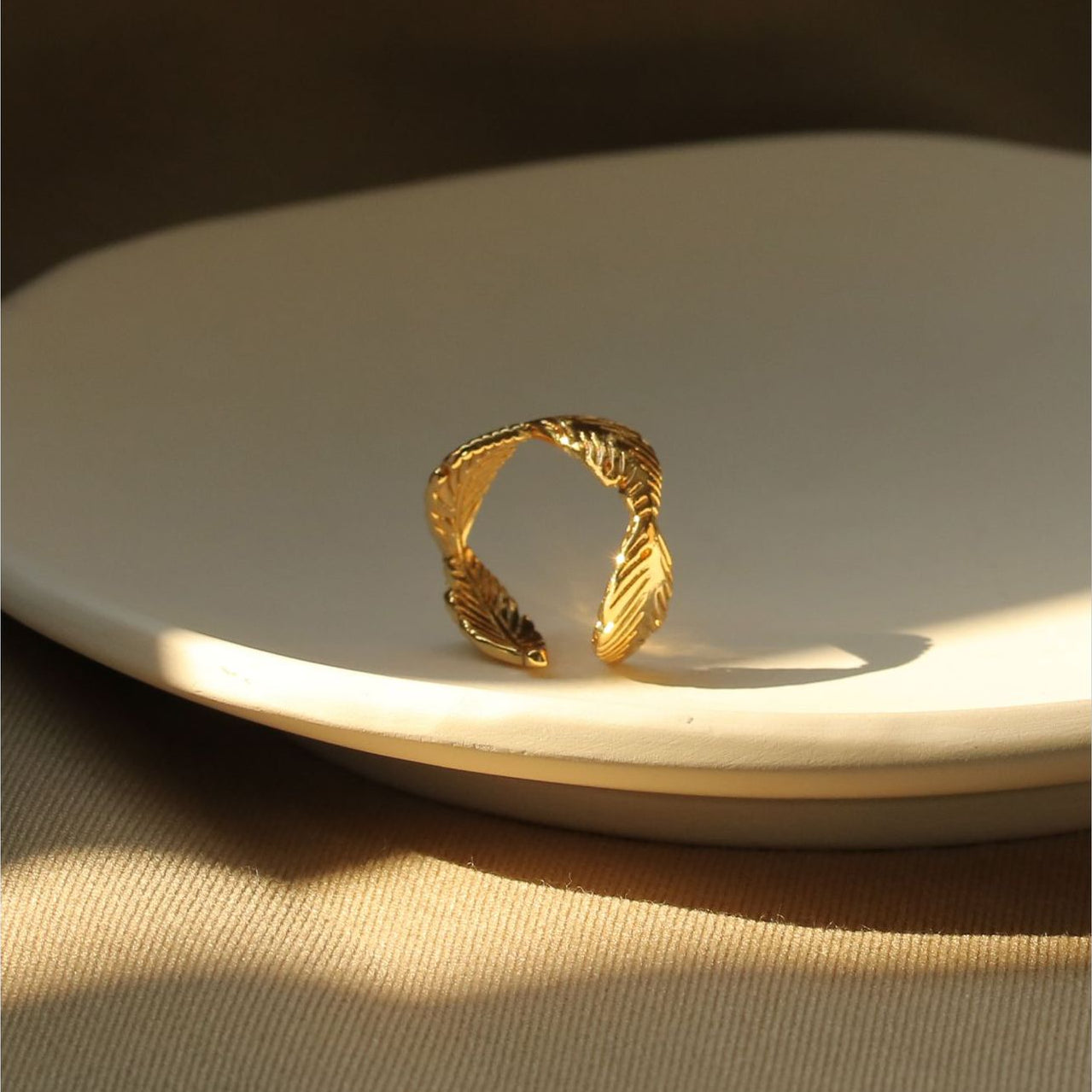 ALODIA LEAVES RING IN BRASS WITH 18K GOLD FINISH