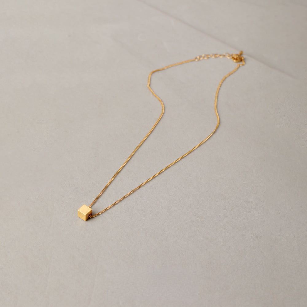 ALODIA  THE CUBE NECKLACE IN BRASS WITH 18K GOLD FINISH MATTE GOLD