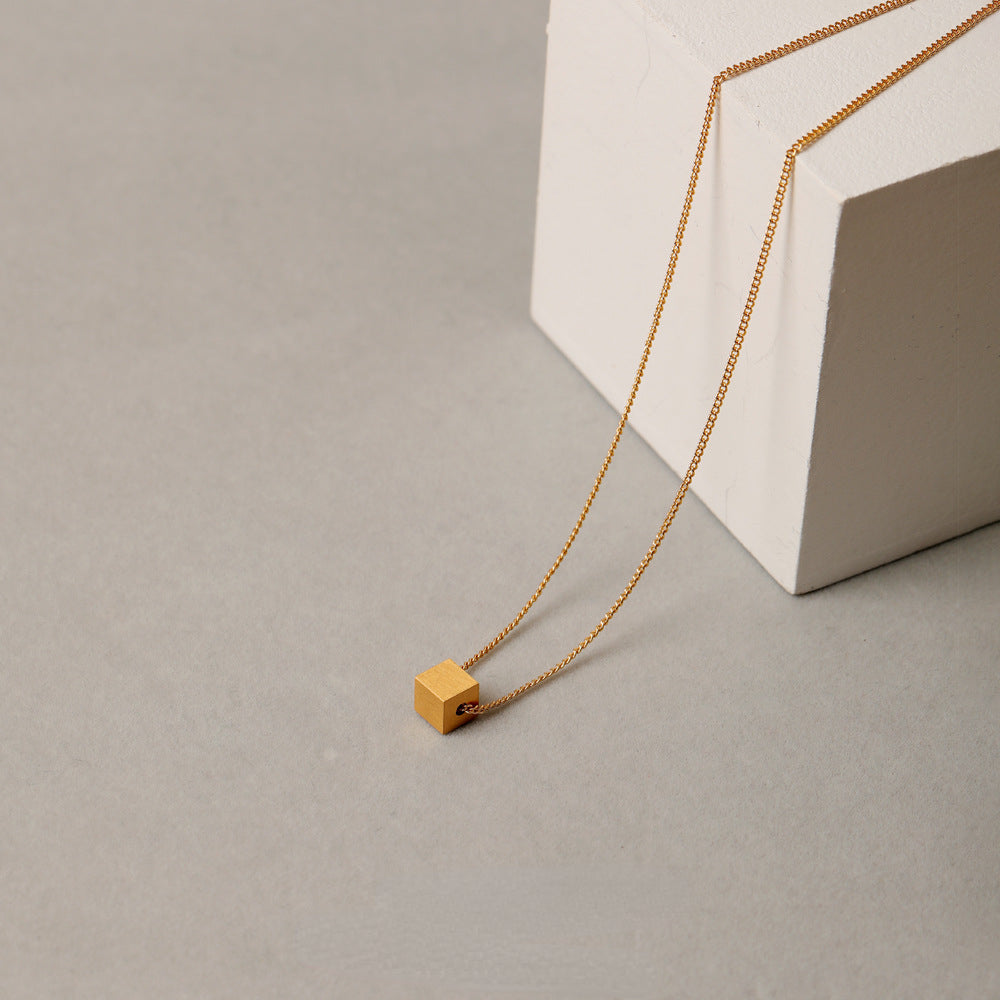 ALODIA  THE CUBE NECKLACE IN BRASS WITH 18K GOLD FINISH MATTE GOLD