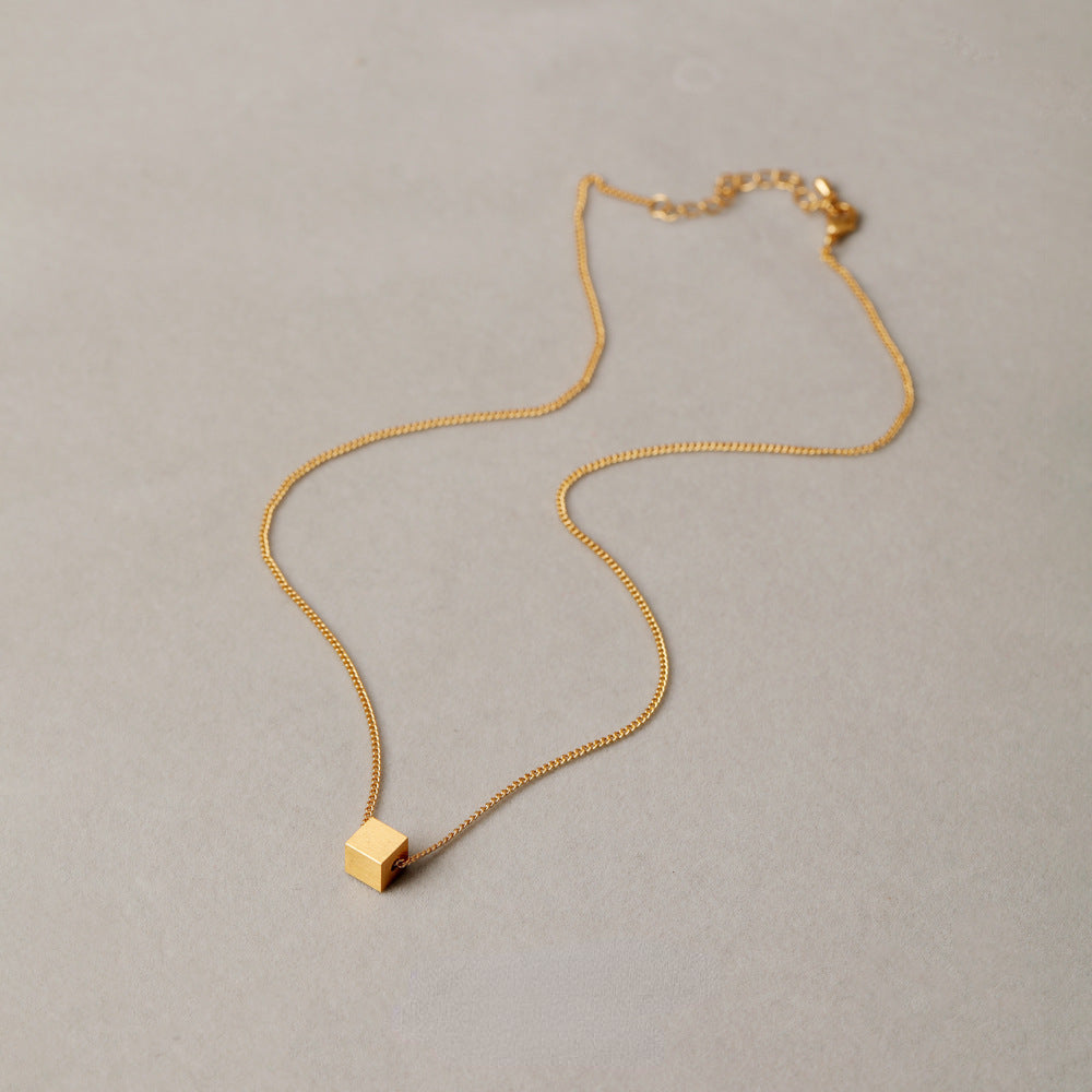 ALODIA  THE CUBE NECKLACE IN BRASS WITH 18K GOLD FINISH MATTE GOLD