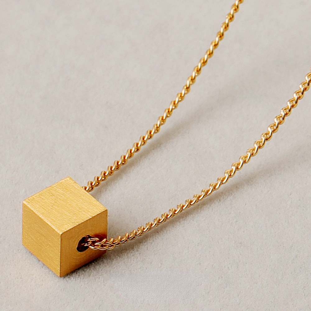 ALODIA  THE CUBE NECKLACE IN BRASS WITH 18K GOLD FINISH MATTE GOLD