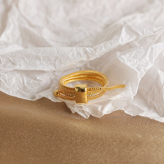 ALODIA  ENTANGLE RING IN BRASS WITH 18K GOLD FINISH  ADJUSTABLE