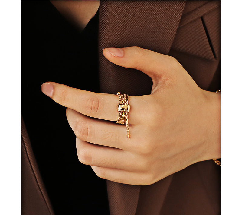 ALODIA  ENTANGLE RING IN BRASS WITH 18K GOLD FINISH  ADJUSTABLE